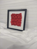 Red Clover Twists, framed in black